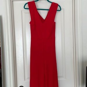 Red jump suit with open back